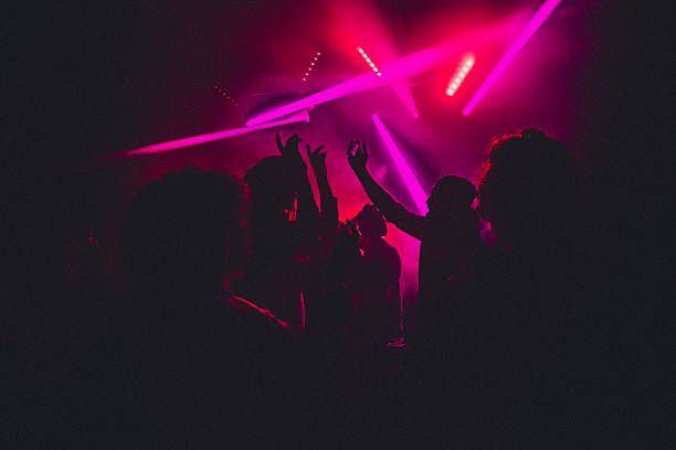 Crowd dancing under pink disco lights at a DJ Dan Endicott mobile disco in Doncaster