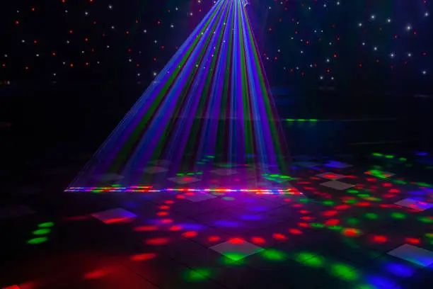 Mobile DJ hire lighting with blue, purple and green beams on a Doncaster dance floor